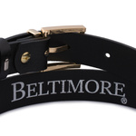 Czarny pasek damski skórzany. Złota klamra. 105 cm.